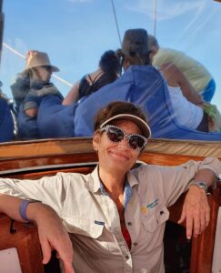 Maree lounging in comfy chair on a sailing boat in Florence Bay, Magentic Island